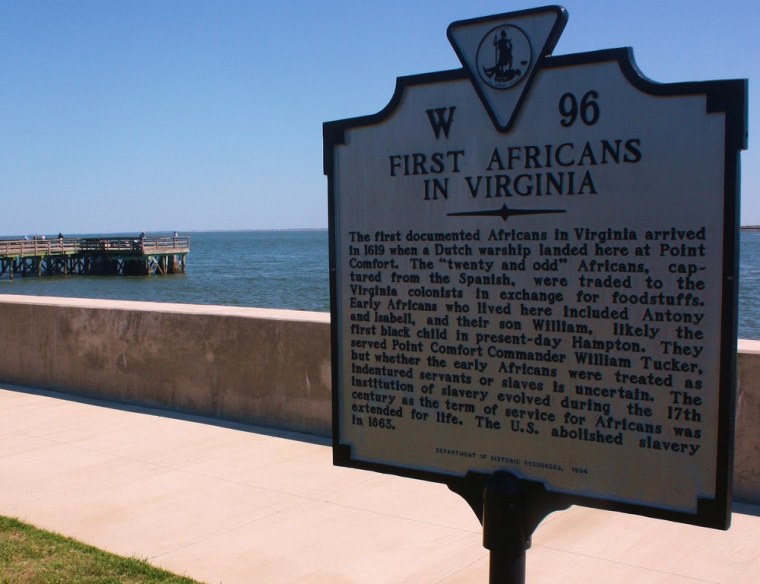 Image: A sign explains Fort Monroe's history as the landing spot for the first Africans to arrive in what would become America, in Chesapeake, Virginia